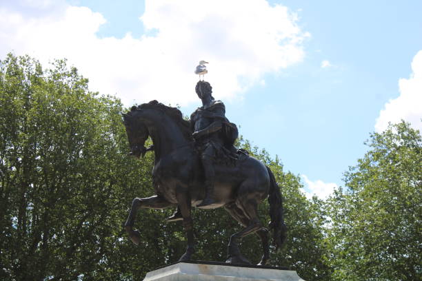 It is the Statue of Minckelers, located in the market of Maastricht, the Netherlands. This statue was designed by Bart van Hove and was revealed on July 10, 1904.