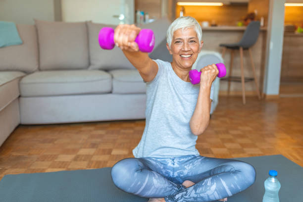 istock Mature Woman Exercise At Home 1159868240
