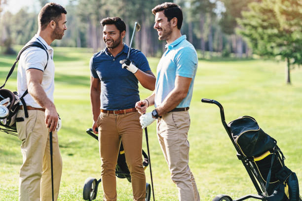 istock Group of golfers resting and chatting on the course 1159871690