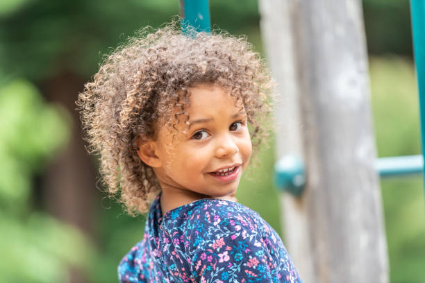 istock Smiling little girl looking at the camera 1159871729
