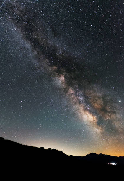 istock Beautiful night landscape. Bright milky way galaxy over the hills. 1159873949