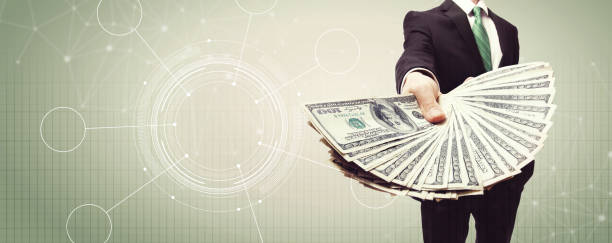 istock Tech circle with business man with cash 1159875890