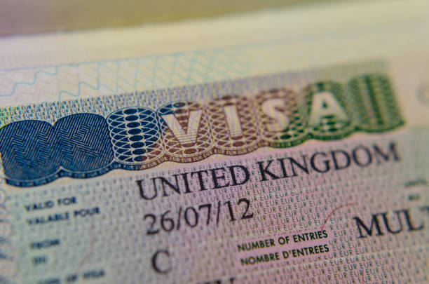 UK Multiple Entry Visa (Type C) sticker in the passport. stock photo