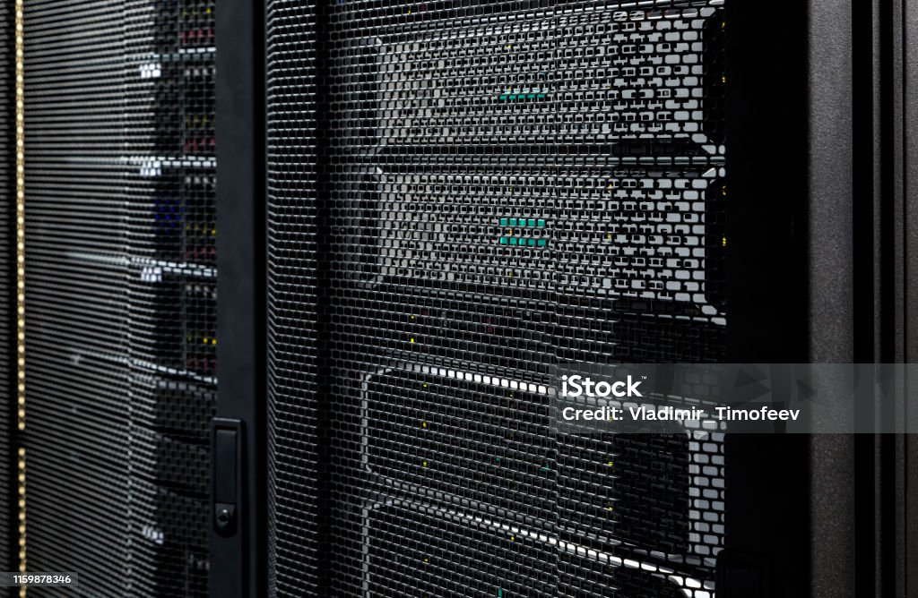 Close up server racks in modern data center background Close up server racks in modern data center background. Ethernet modules in datacenter room, network, cellular and telecommunication technology concept. Control center for internet provider Connection Stock Photo