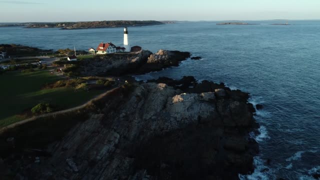 Aerial view of New England coastline and lighthouse (4k)