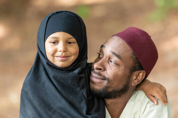 Muslim father and daughter at her first day of school Black Muslim father and daughter at her first day of school kenyan man stock pictures, royalty-free photos & images
