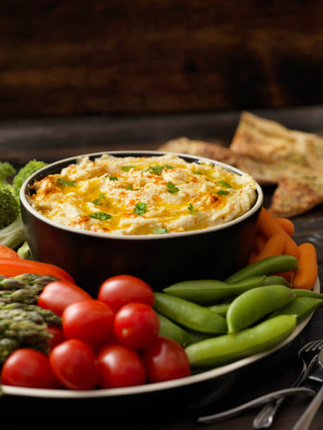 istock Roasted Garlic Hummus with Veggies and Pita Chips 1159882773