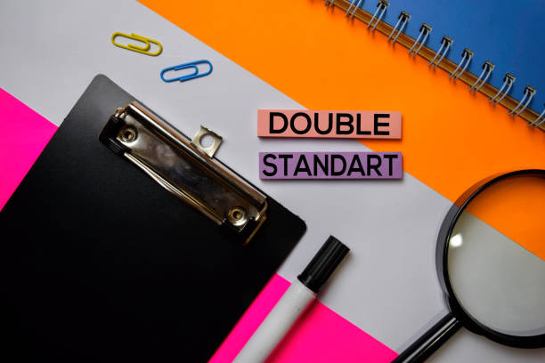 istock Double Standart text on sticky notes with color office desk concept 1159903407