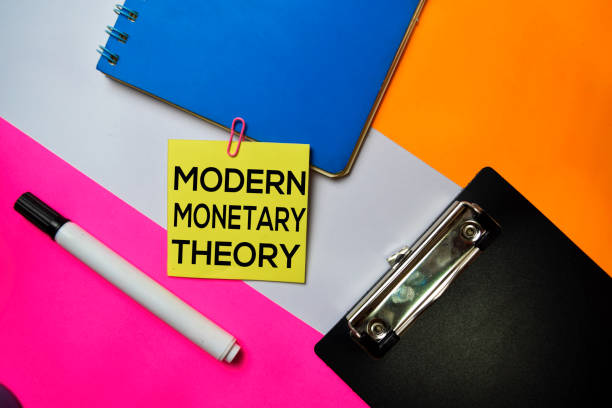 istock Modern Monetary Theory text on sticky notes with color office desk concept 1159903409