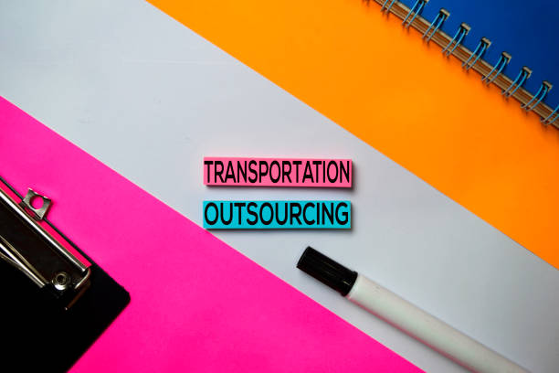 istock Transportation Outsourcing text on sticky notes with color office desk concept 1159903973