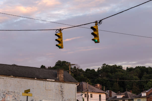istock Two traffic lights hang from a wire in small midwestern town 1159903977