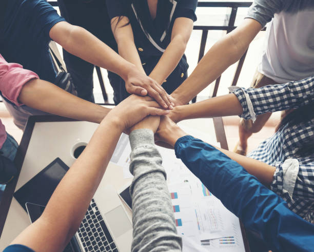 istock together collaborate of hands teamwork in meeting room office 1159904308