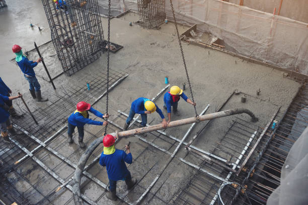 istock The worker in blue working in construction site with cement 1159904316