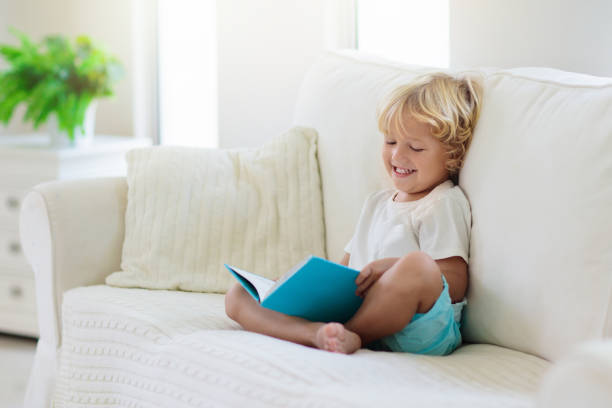 istock Child reading book. Kids read books. 1159905986