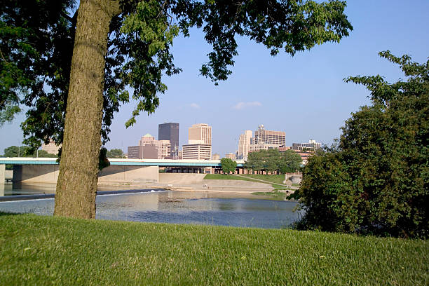 City of Dayton on the River View of a city on a river. City featured is Dayton, Ohio. dayton ohio skyline stock pictures, royalty-free photos & images