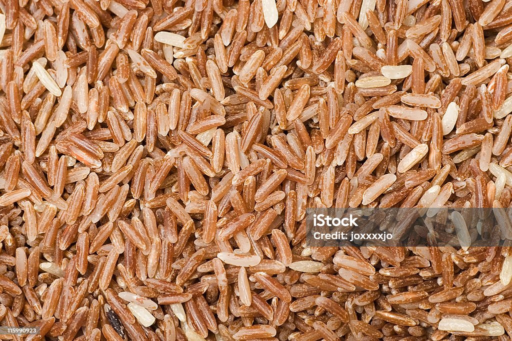 Marrón arroz de grano textura de - Foto de stock de Arroz - Comida básica libre de derechos