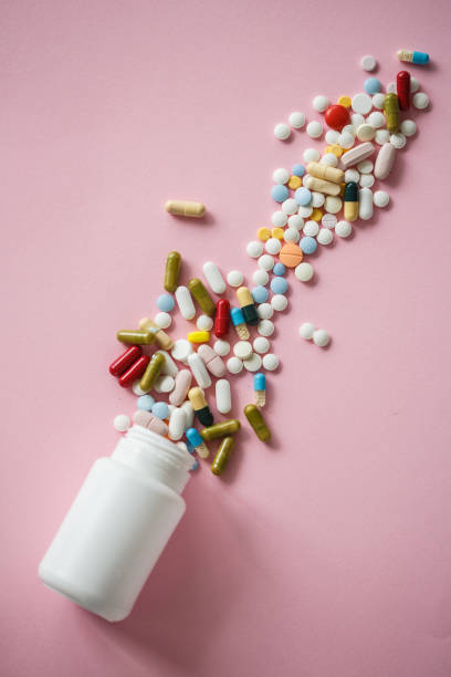 istock Pill bottle with spilling varied medicine 1159909683