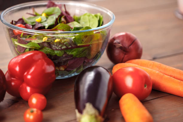 istock Vegetable salad isolated on table ready for eating healthy lifestyle 1159909743