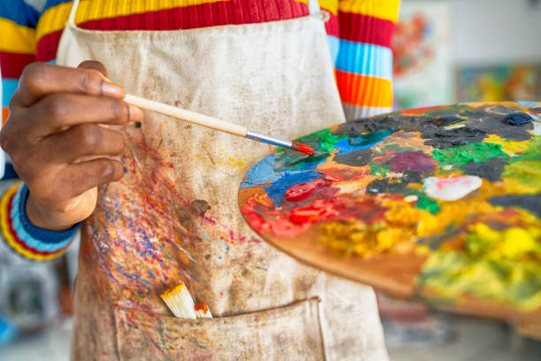 istock Female artist working in studio 1159909828