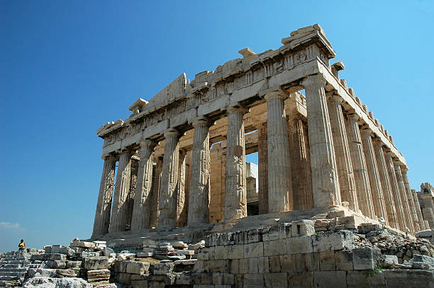 Ruins of the Parthenon in Greece against a blue sky stock photo