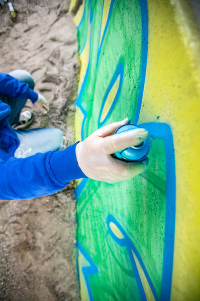 istock Spraypainting a Concrete Wall from Directly Above 1159912375