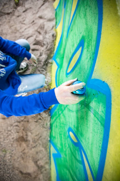 istock Spraypainting a Concrete Wall from Directly Above 1159912377