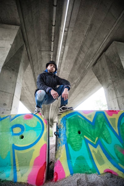 istock Proud Young Graffiti Artist and his Finished Work 1159912395