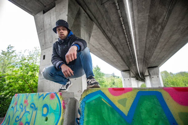istock Proud Young Graffiti Artist and his Finished Work 1159912396