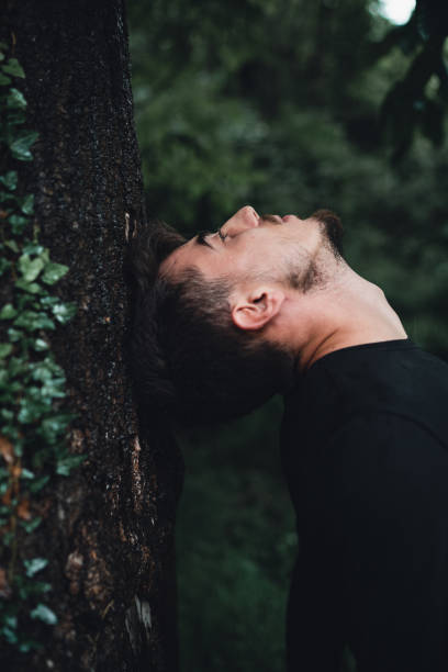 istock Side view of young man in nature 1159919577