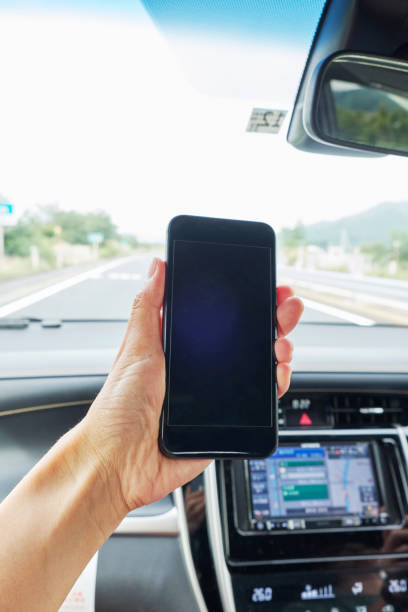 istock Car driving and smartphone 1159924247