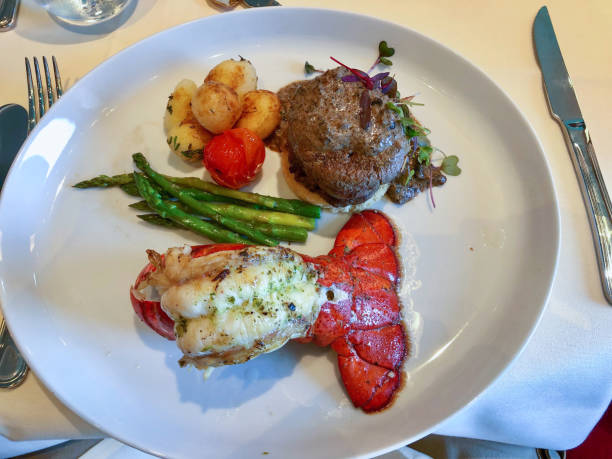 istock Steack and lobster tail on a plate in restaurant table 1159927208