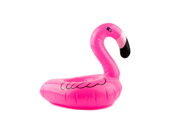 istock Mini inflatable pink flamingo on a white background. Pool float party. Summer concept. 1159928342