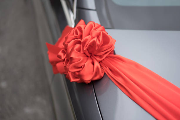istock Wedding car decoration red ribbon 1159930252