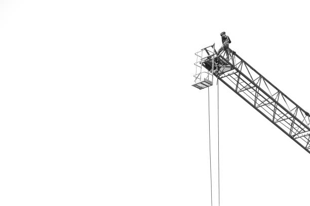 Black and white of Workers on a large construction crane on white background