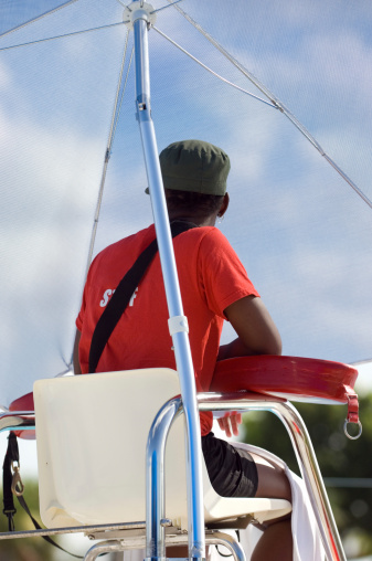 Lifeguard looking out for danger