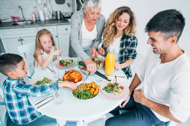 istock Multi-generation family having lunch at home. 1159944574