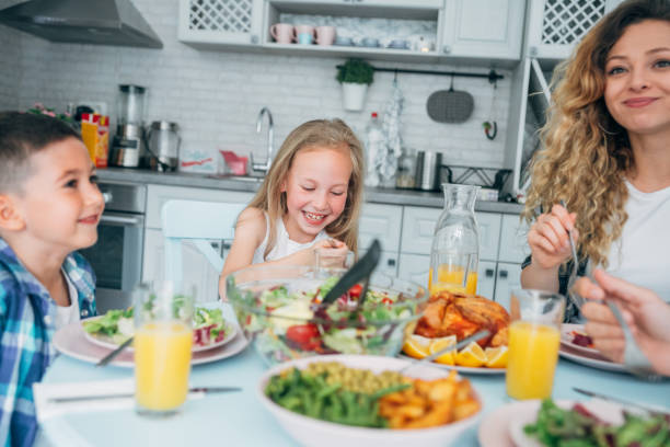 istock Cheerful family having lunch 1159944575