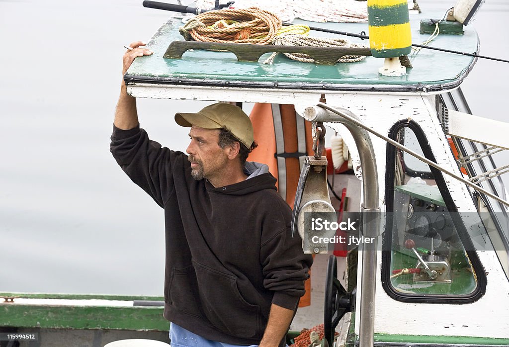 Fisherman A Maine lobster fisherman sets out in his lobster boat. Lobster - Animal Stock Photo