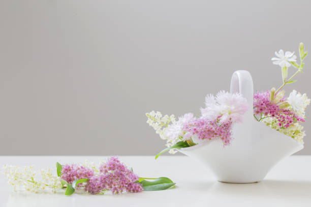 summer flowers in white ceramic basket