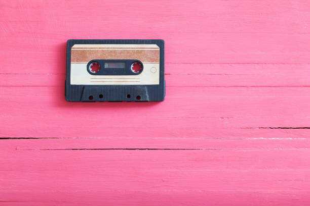 istock Old plastic cassette on wooden background. Retro music concept 1159947965