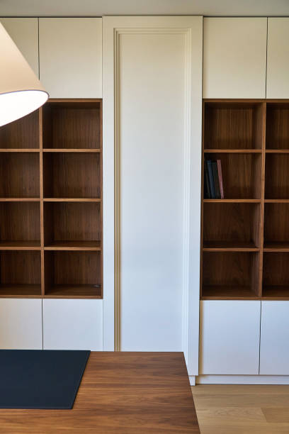 istock Design of wooden bookcase for modern office 1159948092