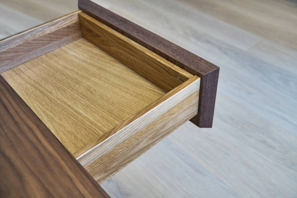 istock Open drawer of wooden table in office 1159948662