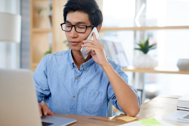 istock I'm just calling to confirm a few details... 1159949209