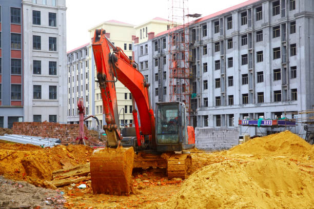 building panorama with the excavator in the foreground