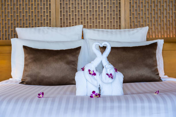 istock Beautiful elephant towel on bed decoration in bedroom interior 1159950974