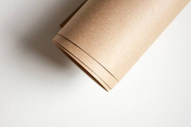 rotolo di carta kraft. - packaging paper cardboard rolled up foto e immagini stock