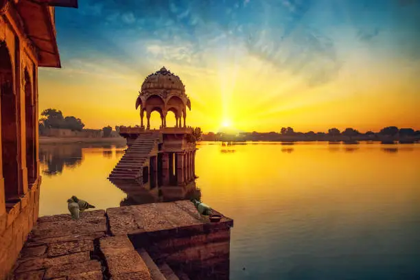 Photo of Ancient architecture ruins at Gadi Sagar (Gadisar) lake Jaisalmer, Rajasthan at sunrise