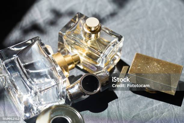 Perfume Bottle In The Sun Image Stock Photo - Download Image Now - Perfume, Scented, Perfume Sprayer