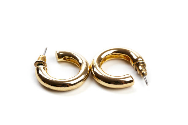 istock golden earrings isolated on white background 1159953016