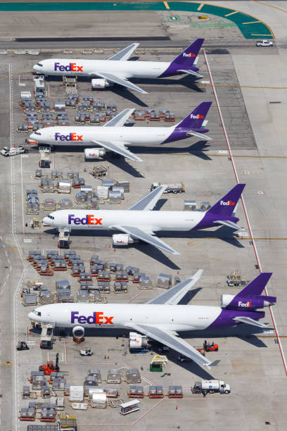 FedEx Express airplanes Los Angeles airport aerial view Los Angeles, California – April 14, 2019: Aerial view of FedEx Express airplanes at Los Angeles airport (LAX) in the United States. air transport building stock pictures, royalty-free photos & images